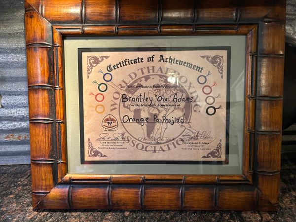 Certificate of achievement in World Thai Boxing Association for Brantley 'Chai' Adams.