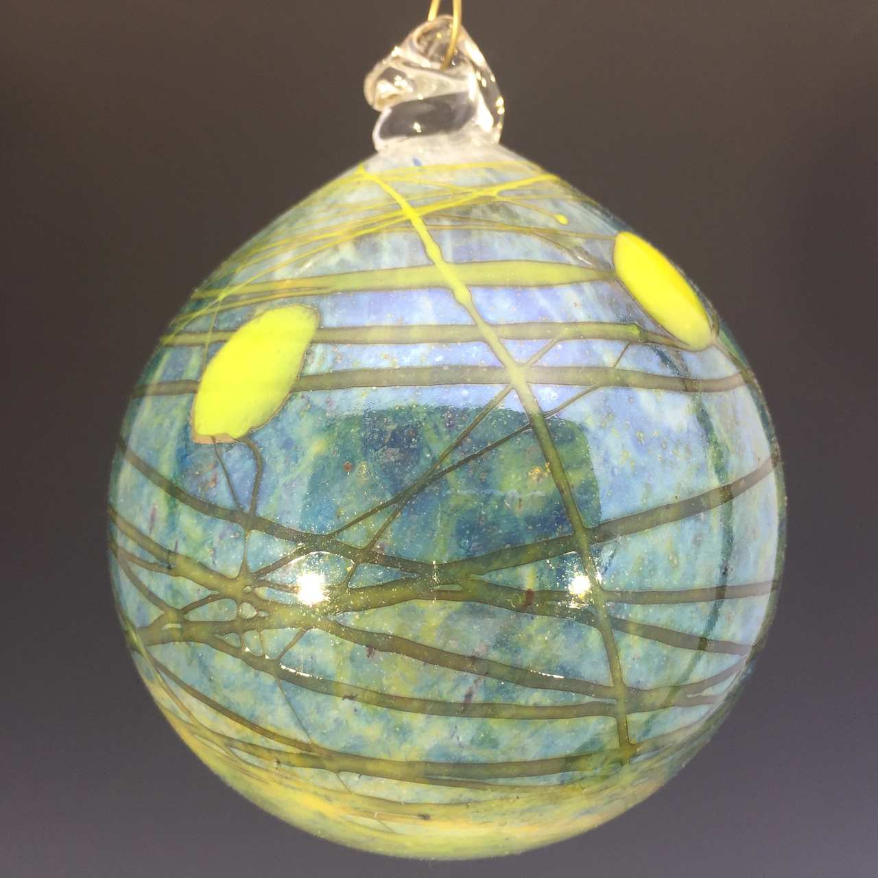 Ball ornament bluish green with yellow accents