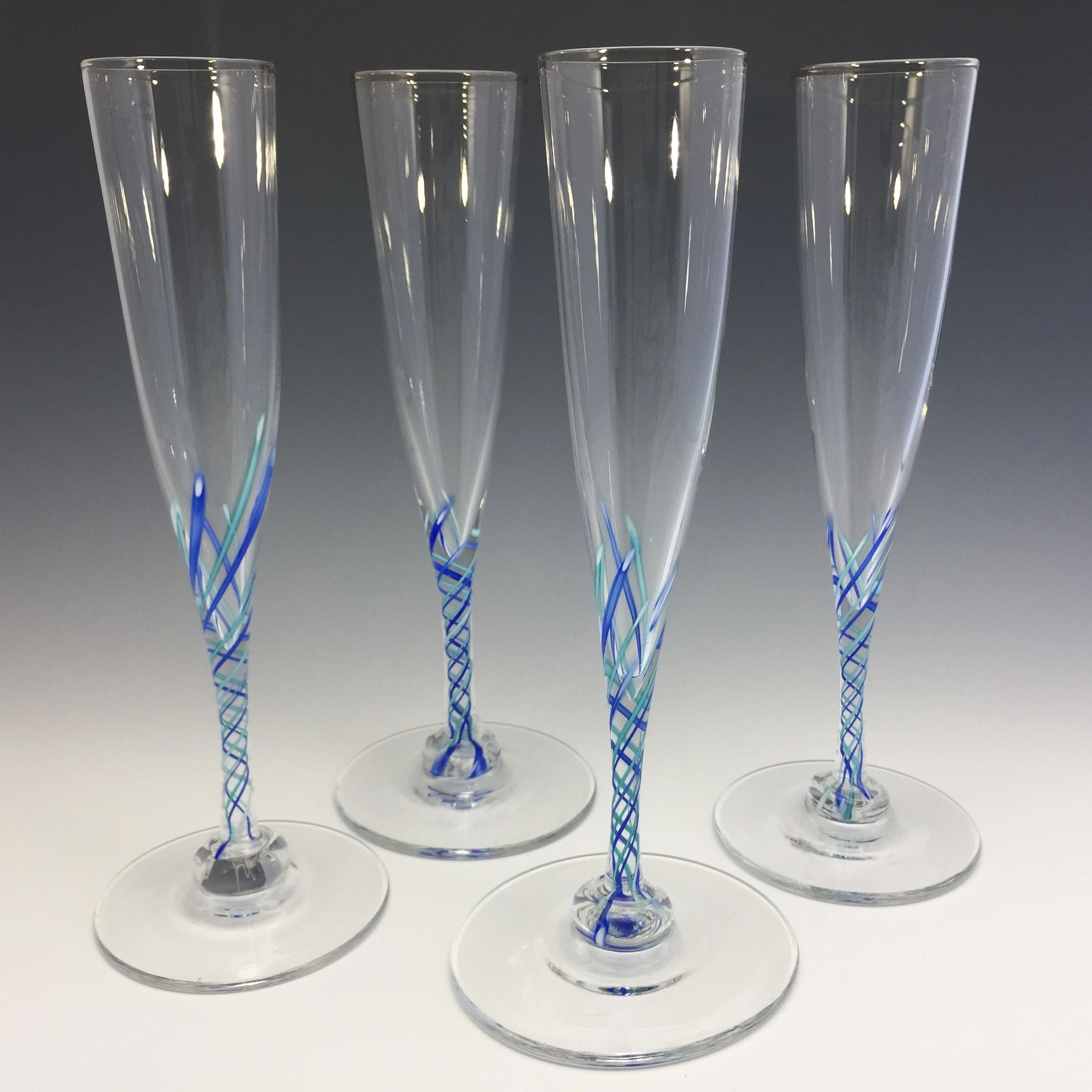 Blue latticino champagne flutes hand blown by Alex Kalish