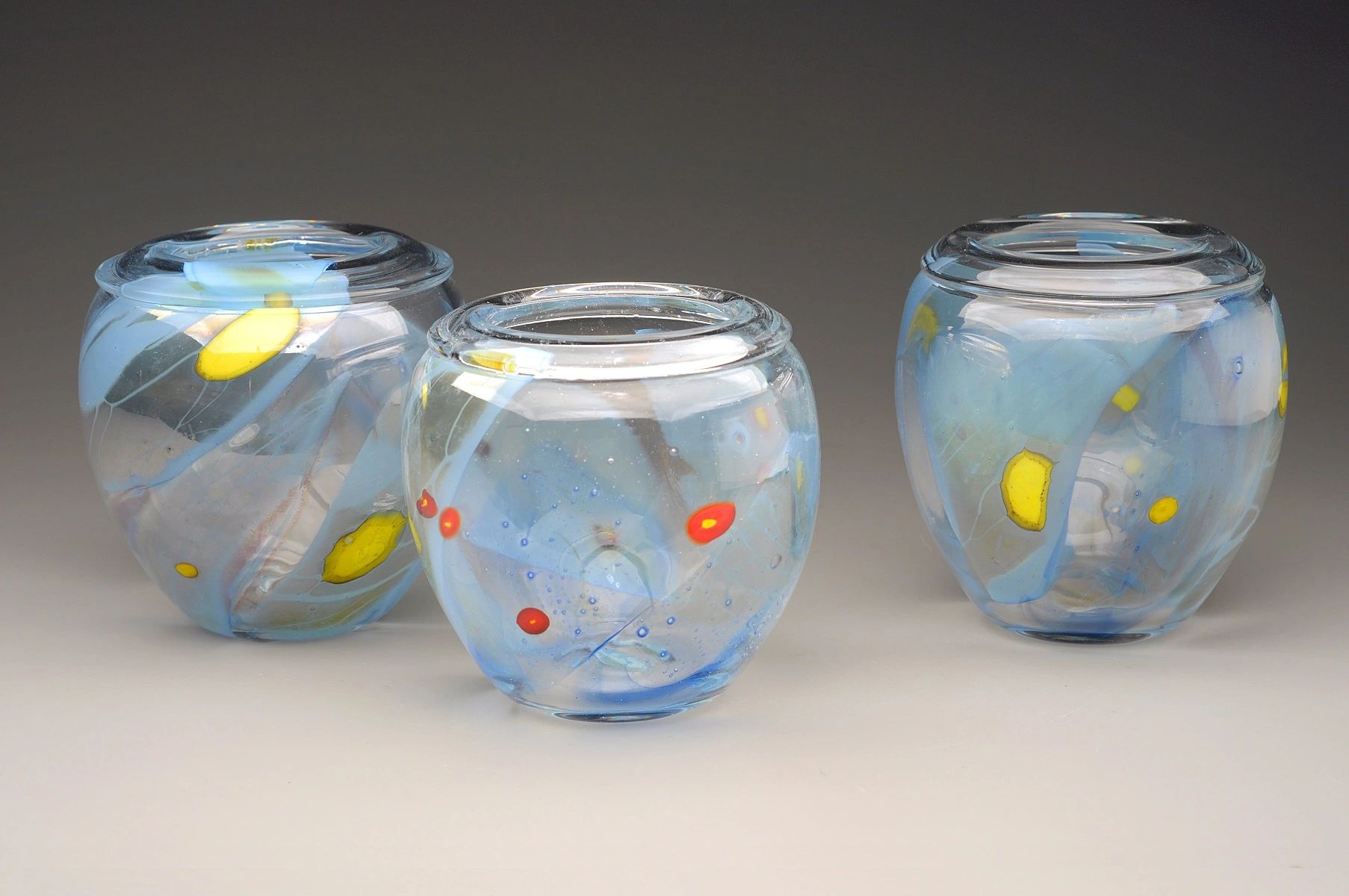 Clear squatty vase group