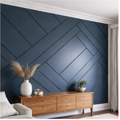 Modern living room with a geometric dark blue accent wall and wooden sideboard.