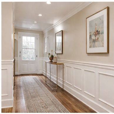 Elegant hallway with wooden floors and classic decor.