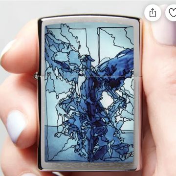 Zippo lighter with blue angel artwork by Lisa Domenic on front