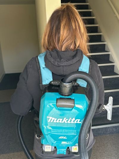 backpack hoover cleaning stairwell