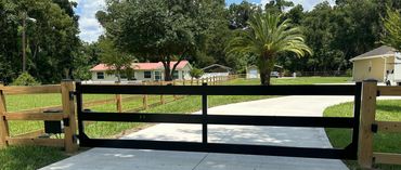 custom driveway gate. Electric Liftmaster opener. 
top rail fence, Daves fence, C&S fence, fence out