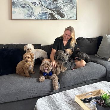 Pico Pups owner Katrina with some of the Pico Pups Daycare family!