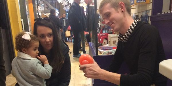 One of our extremely talented balloon artists twisting up a bit of curiosity for a child