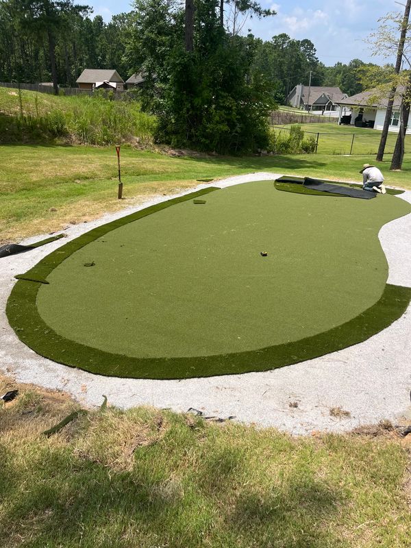 Shaping the turf and laying the outer layer.