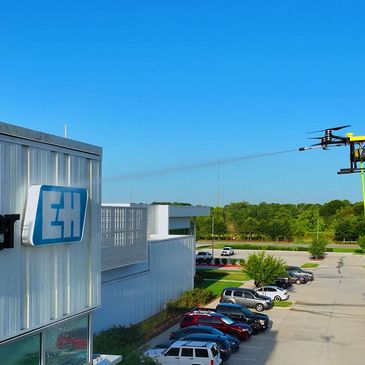 Building washing by drone cleaning services SkyWash Drone. power wash drone.