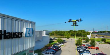 Building washing by drone cleaning services SkyWash Drone. power wash drone.