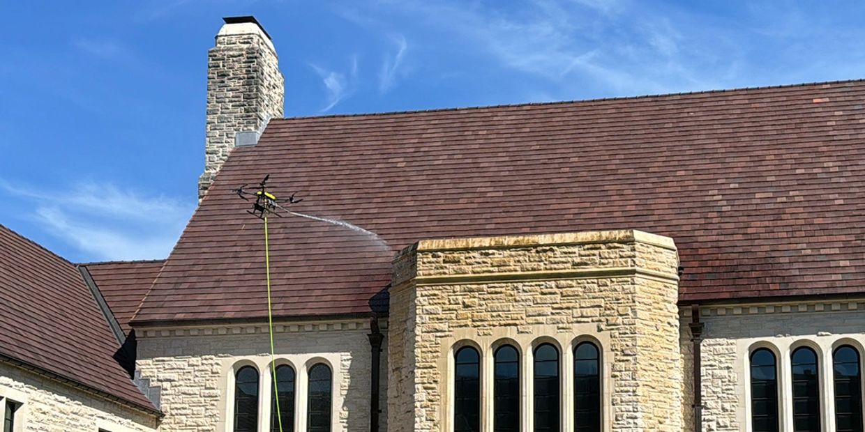 Drone cleaning the facade of a government building.