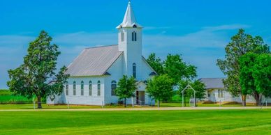 a building steeple is getting cleaned by the drone cleaning service skywash drone.