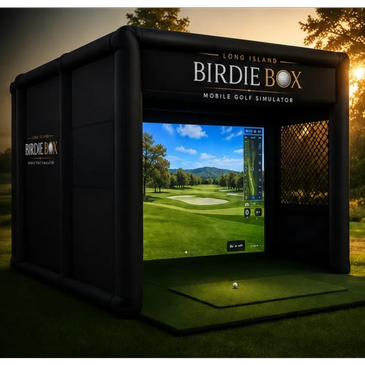Inflatable golf simulator booth at sunset.