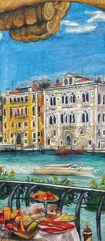 Colorful waterfront buildings with a table of food in the foreground under a bright blue sky.