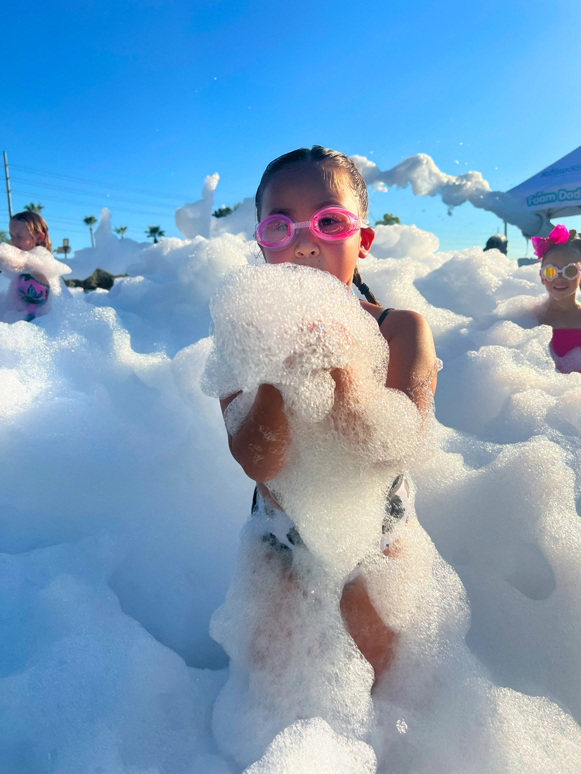 Girl holding foam.