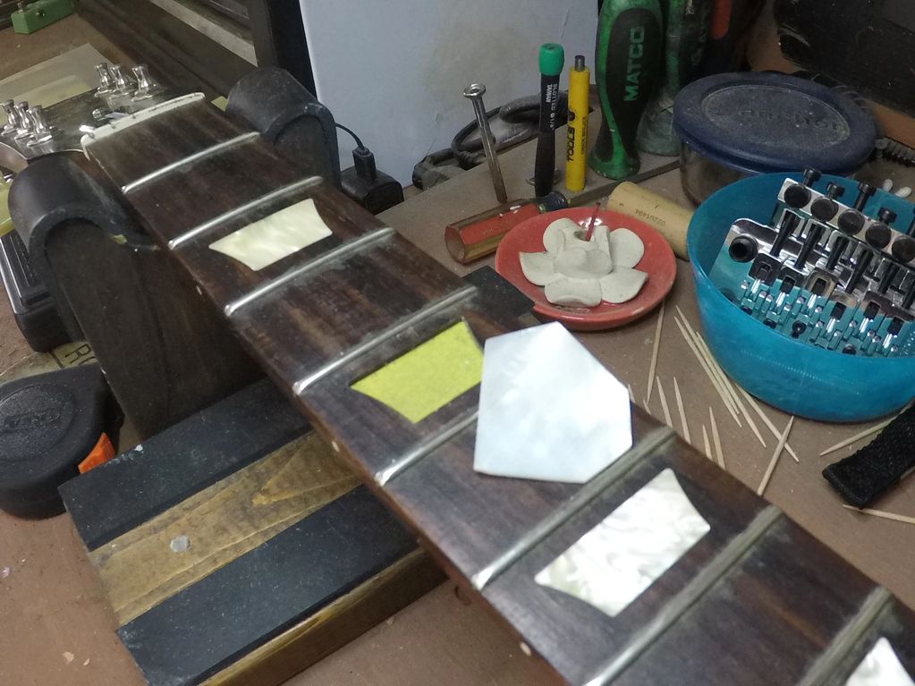 Les Paul white pear inlay repair custom cut by hand 5th fret inlay after a show. Gibson Les Paul.