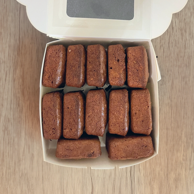 lactation brownies in a white box on a wooden table