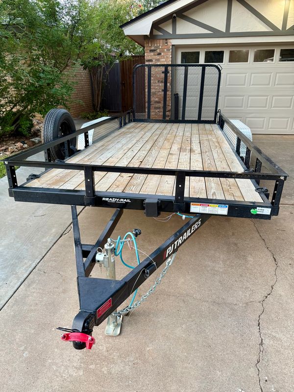 16ft PJ utility trailer rental in Lubbock, TX with spring assisted drop down gate.