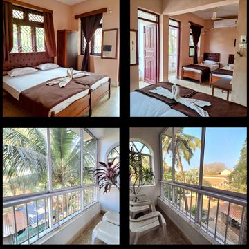 Cozy bedroom with balcony views of palm trees and nature.