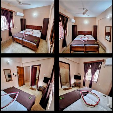 Cozy bedroom with a neatly made bed and decorative heart arrangement.