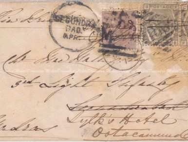 Vintage handwritten letter with old postage stamps and postal marks.