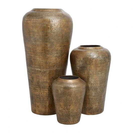 Set of three textured bronze vases in varying sizes.