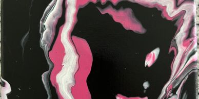 Abstract black, pink, and white fluid art with swirling patterns.