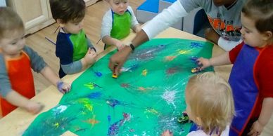 Kids playing with cars on the mat