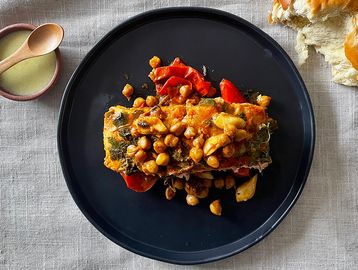 Savory baked fish with chickpeas and peppers.