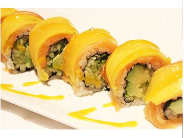 Colorful sushi rolls with mango topping.