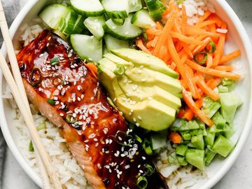Salmon rice bowl with avocado and vegetables.