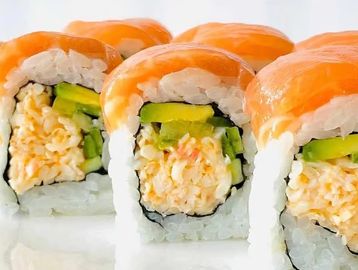 Close-up of sushi rolls with salmon and avocado.