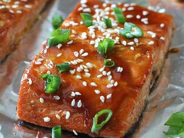 Teriyaki glazed salmon with sesame and green onions.