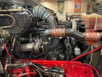 Custom diesel engine modification with performance parts.