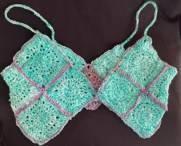 A dainty tank top or beach cover made of granny squares 