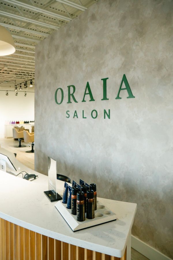 Reception desk at Oraia Salon with hair products.