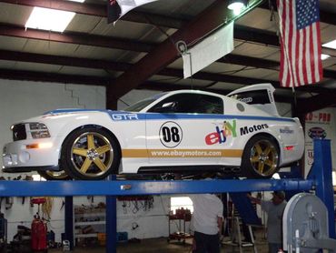 Car on Lift in Auto Repair Garage