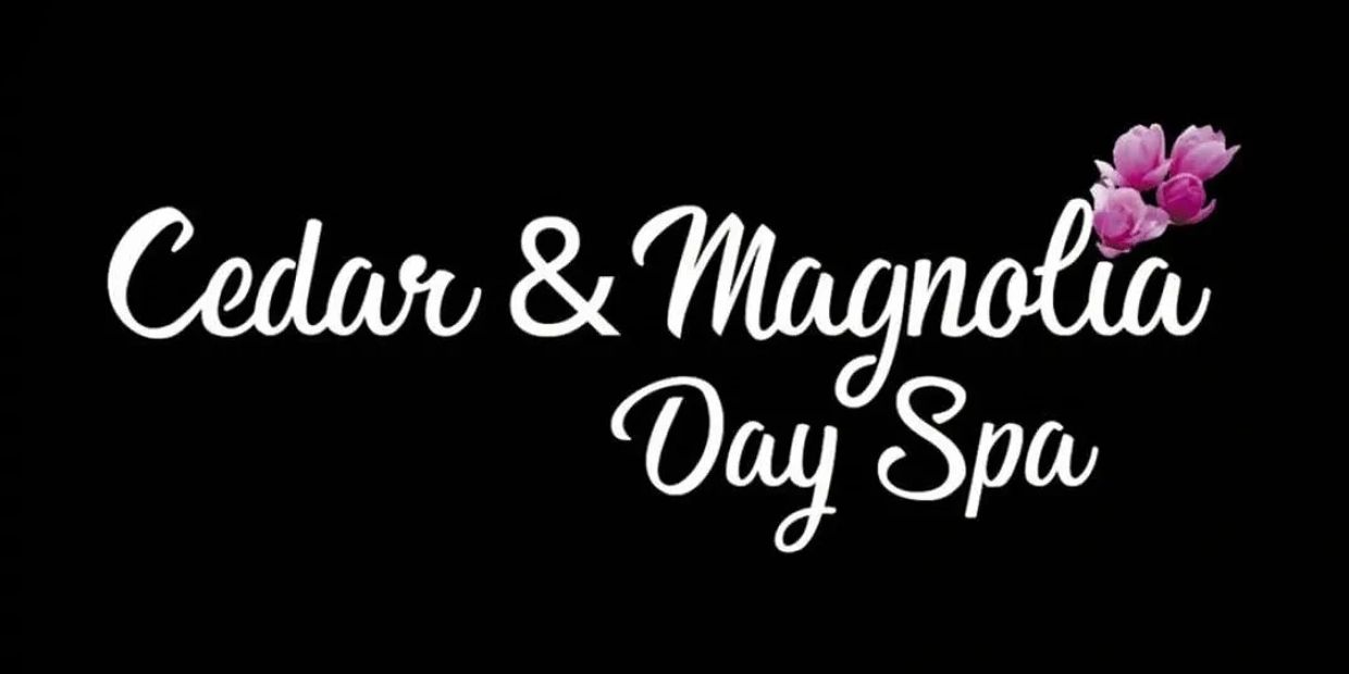 Logo for Cedar &amp; Magnolia Day Spa with floral accent.