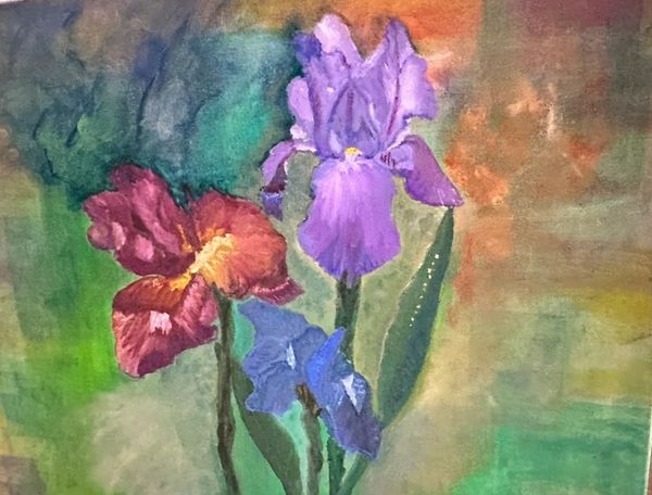 Oil painting of jewel-toned irises poking out of a green patch. 