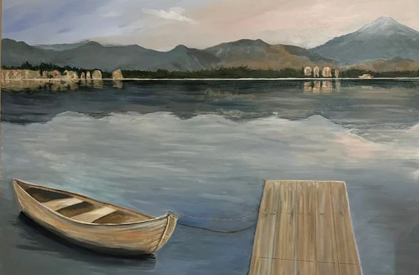 A large and calming vision of serenity on a still lake at dusk with a boat and dock.