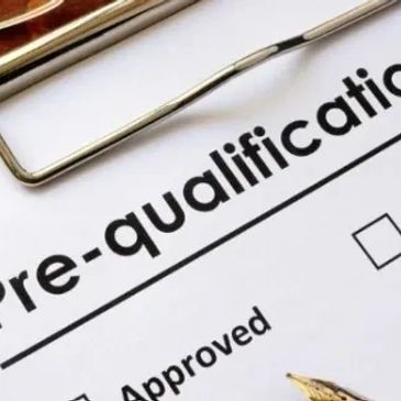 Close-up of a pre-qualification form with a checkbox and pen.