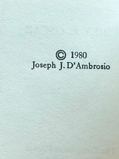 Copyright notice from 1980 by Joseph J. D'Ambrosio on textured paper.