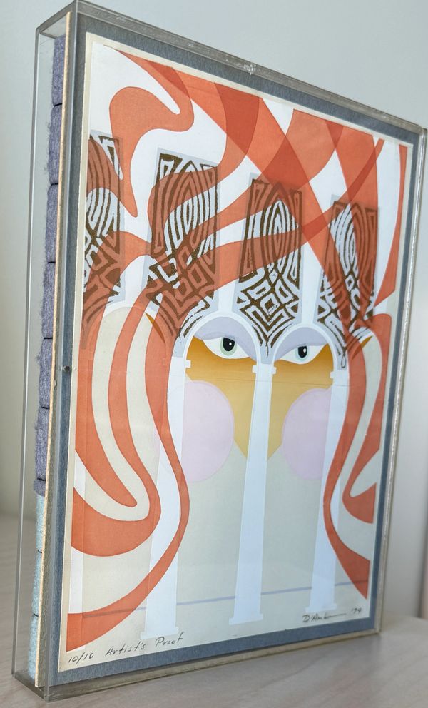 Abstract artwork with eyes and swirling orange patterns framed in glass.