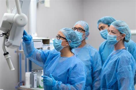 Consulting Team Inspecting an Operating Room.