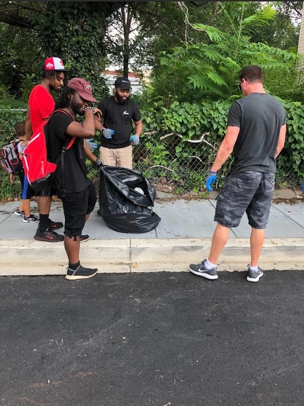 Pete Loftus with his team performing a neighborhood clean up effort. "Our neighborhoods here in 5D02
