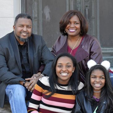 Goosby family sitting on steps