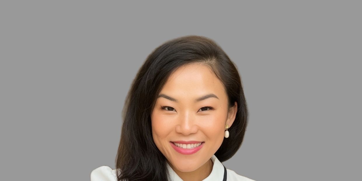 Psychology. Psychotherapy. Mental health counseling woman smiles wearing a white and black blouse.