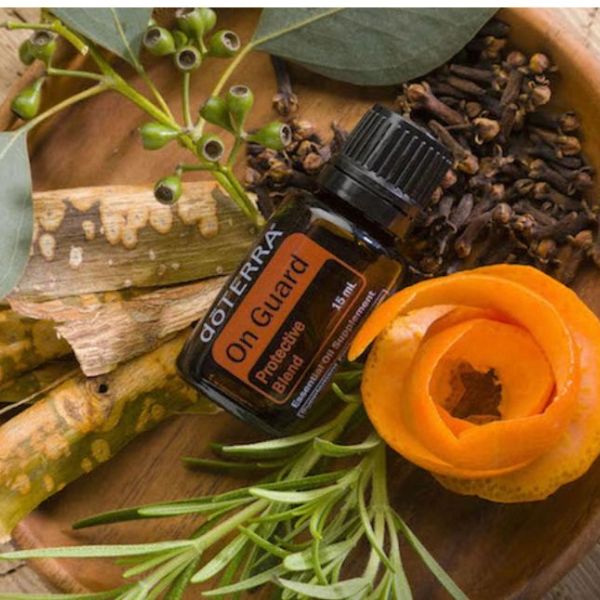 dōTERRA On Guard essential oil bottle with herbs and spices