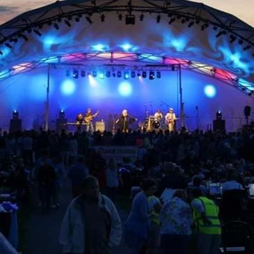 A shot of a sold out crowd and Fleetwood Mac Mania on stage
