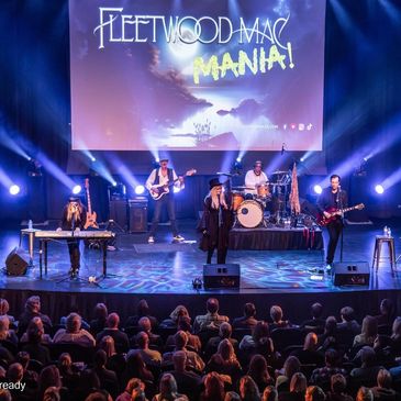 From the audience a shot of Fleetwood Mac Mania on stage in a theatre